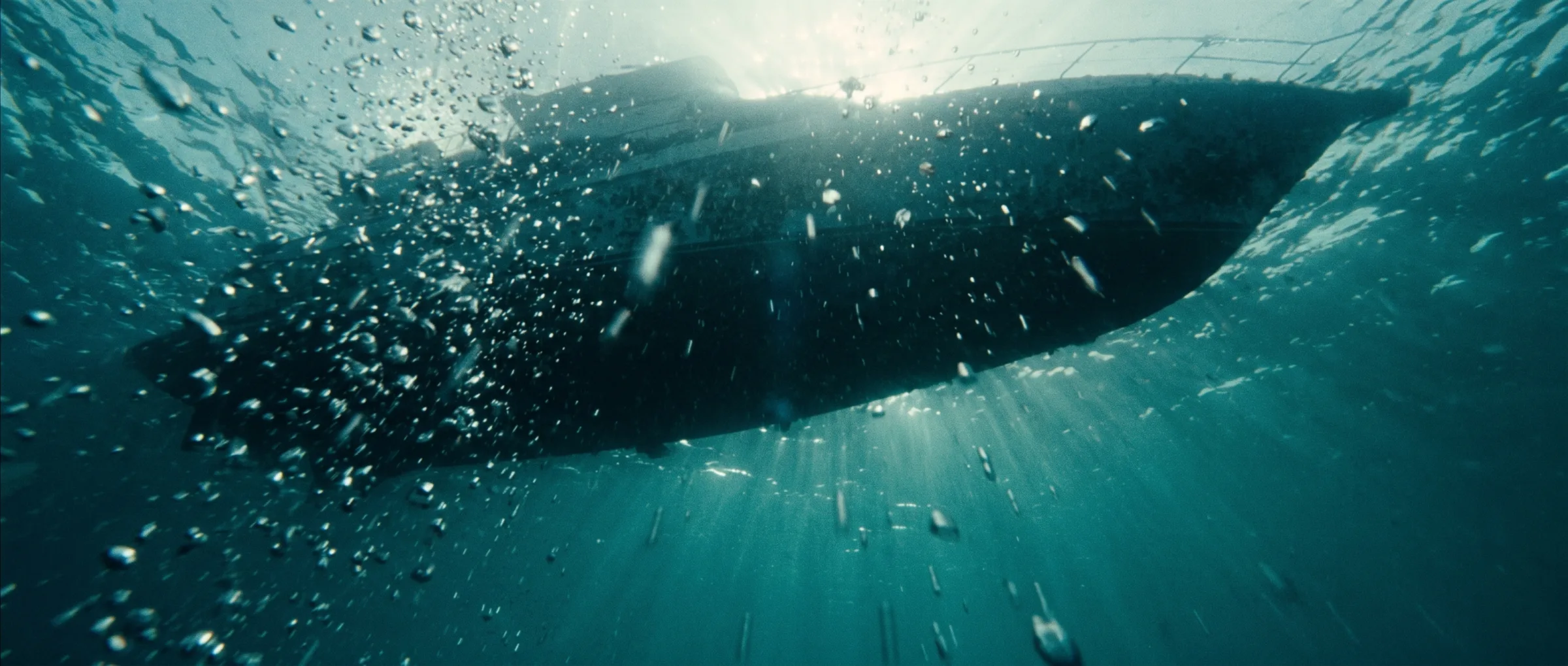 Rising. Just below the surface, before the light arrives.